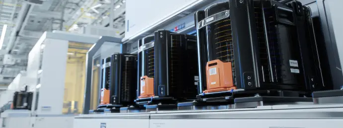 A load-lock vacuum system is used to load devices from ambient air to vacuum systems for semiconductor wafer processing